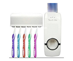 AUTOMATIC TOOTHPASTE DISPENSER WITH TOOTHBRUSH HOLDER