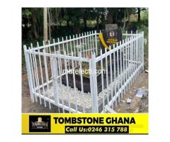 Tombstone with metallic fence